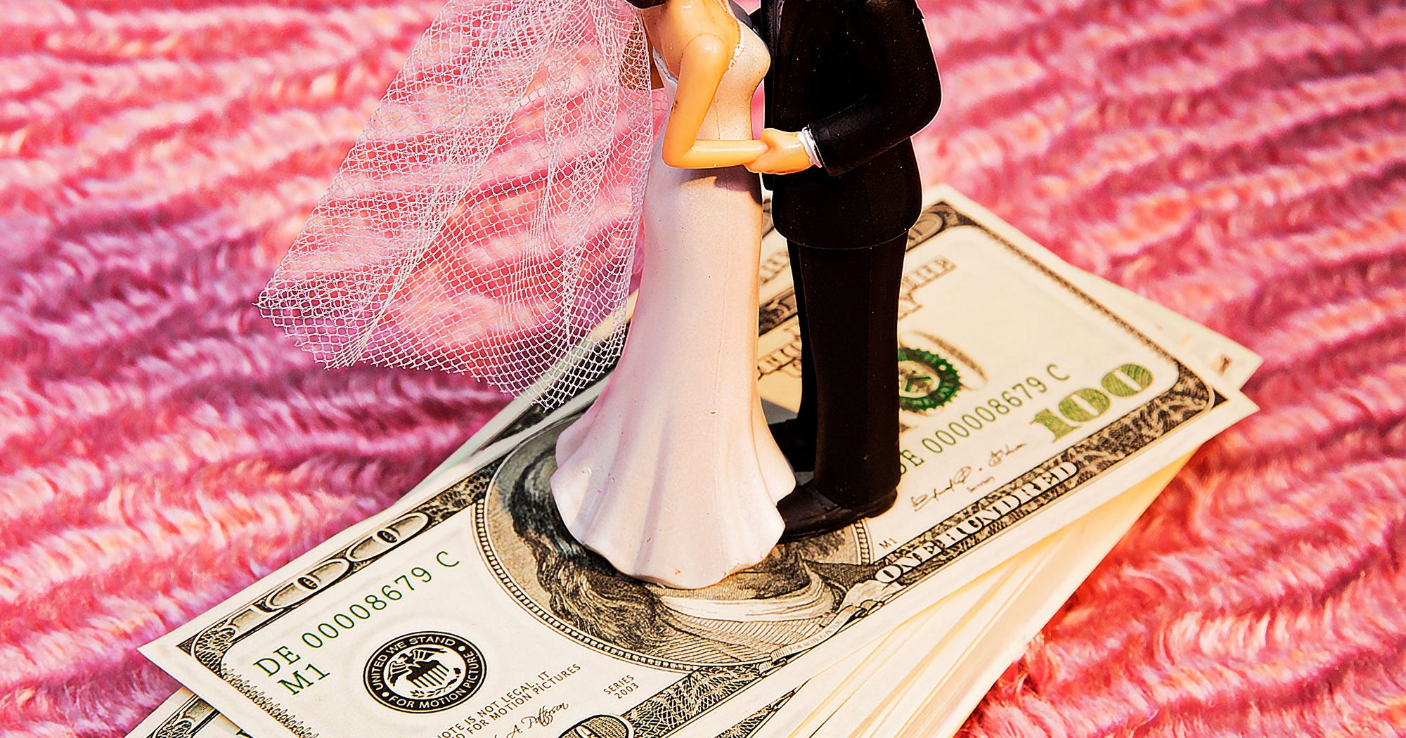 Bride and groom reviewing wedding budget